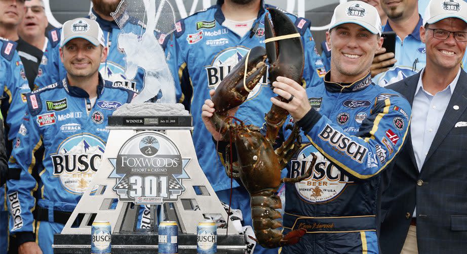 Kevin Harvick holds a lobster.