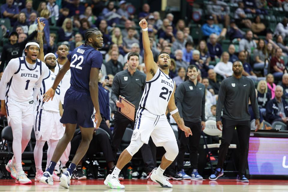 Nov 24, 2023; Kissimmee, FL, USA; Butler Bulldogs guard Pierre Brooks (21) reacts after making a three-point shot against the Penn State Nittany Lions in the second half during the ESPN Events Invitational Consolation game 1 at State Farm Field House.