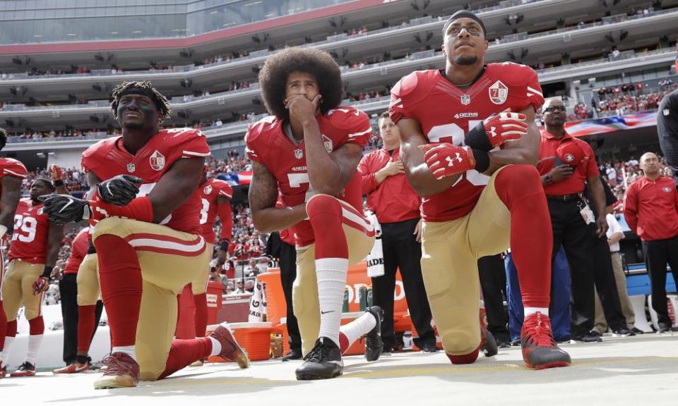 Eric Reid (right) has said he will stand for the anthem next season. 