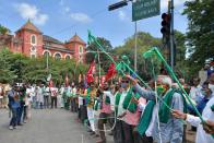 Farmers rights organisations stage a protest during a nationwide farmers' strike following the recent passing of agriculture bills in the Lok Sabha (lower house), in Bangalore on September 25, 2020. - Angry farmers took to the streets and blocked roads and railways across India on September 25, intensifying protests over major new farming legislation they say will benefit only big corporates. (Photo by Manjunath Kiran / AFP) (Photo by MANJUNATH KIRAN/AFP via Getty Images)