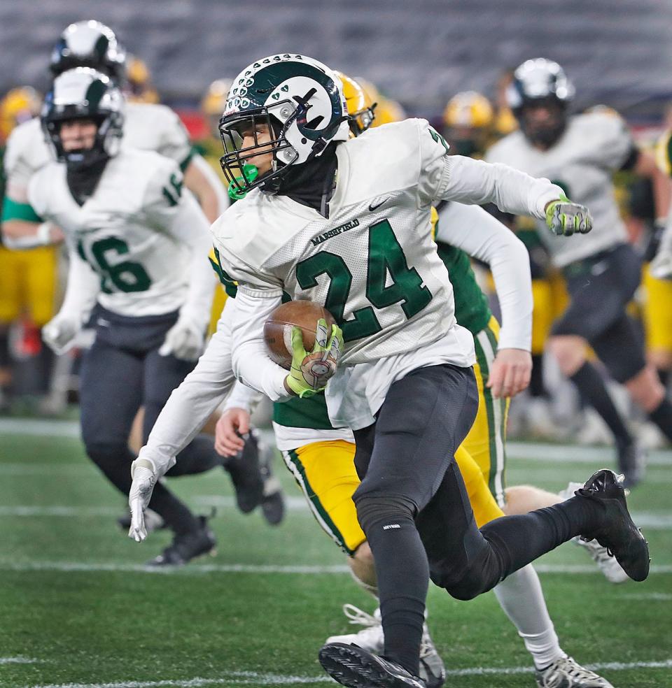 Gio Joseph runs on a sweep play for Marshfield. The Marshfield Rams take on King Phillip High's Warriors in the Div II MIAA Championships at Gillette Stadium on Thursday Nov. 30, 2023
