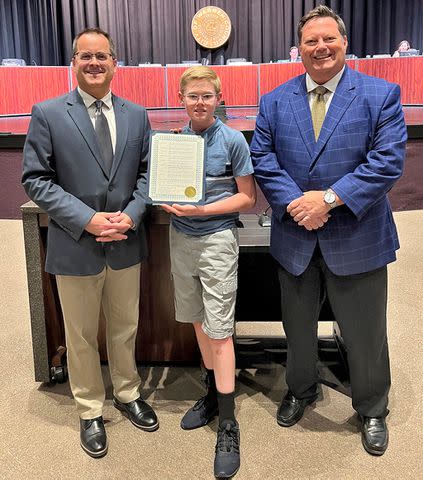 <p>Warren City Council</p> “Look out for each other,” says Dillon (accepting an award from councilman Jonathan Lafferty, left, and Patrick Green, right, in May)