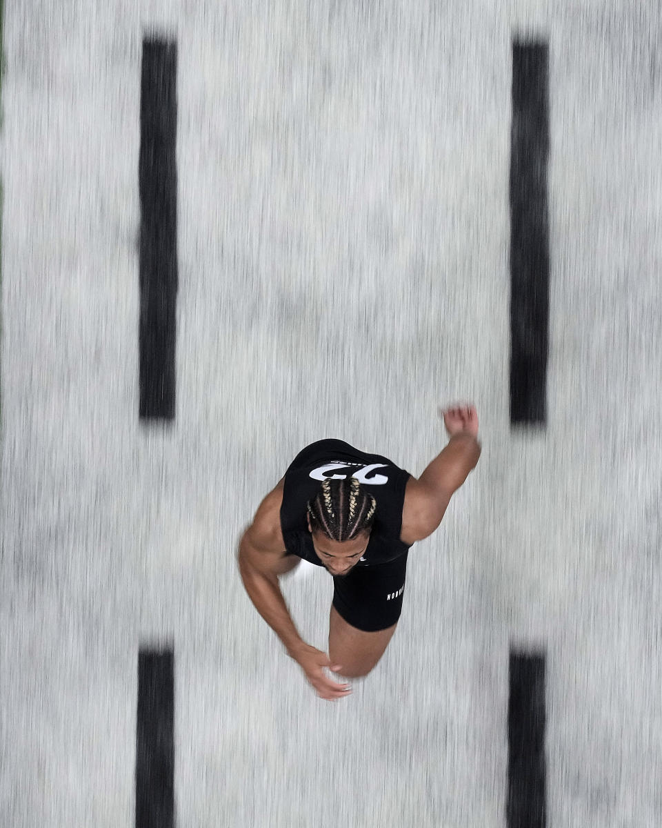 Washington wide receiver Rome Odunze runs the 40-yard dash during the NFL football scouting combine, Saturday, March 2, 2024, in Indianapolis. (AP Photo/Charlie Riedel)