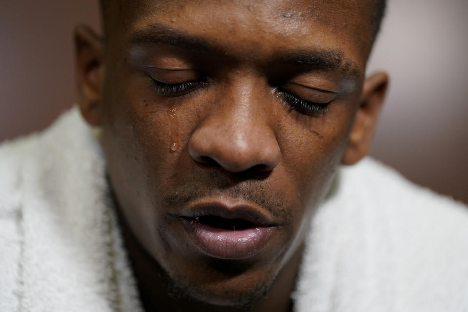 Texas guard Sir'Jabari Rice sheds a tear in the locker room after their loss against Miami in an Elite 8 college basketball game in the Midwest Regional of the NCAA Tournament Sunday, March 26, 2023, in Kansas City, Mo. (AP Photo/Jeff Roberson)