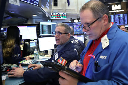 Traders work on the floor of the New York Stock Exchange (NYSE) in New York, U.S., February 4, 2019. REUTERS/Brendan McDermid