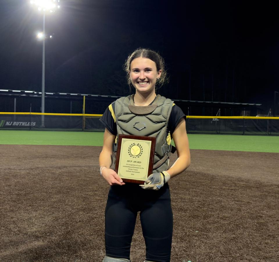 Georgia Tym poses with her Most Valuable Player plaque after Point Boro wins the Ocean County title.