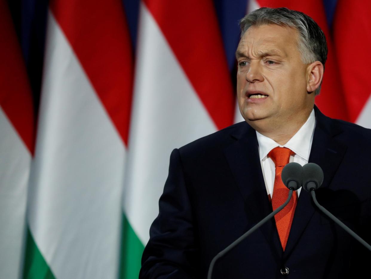 Hungarian Prime Minister Viktor Orban delivers his annual state of the nation speech in Budapest. Slogan reads "For us, Hungary first!": REUTERS/Bernadett Szabo