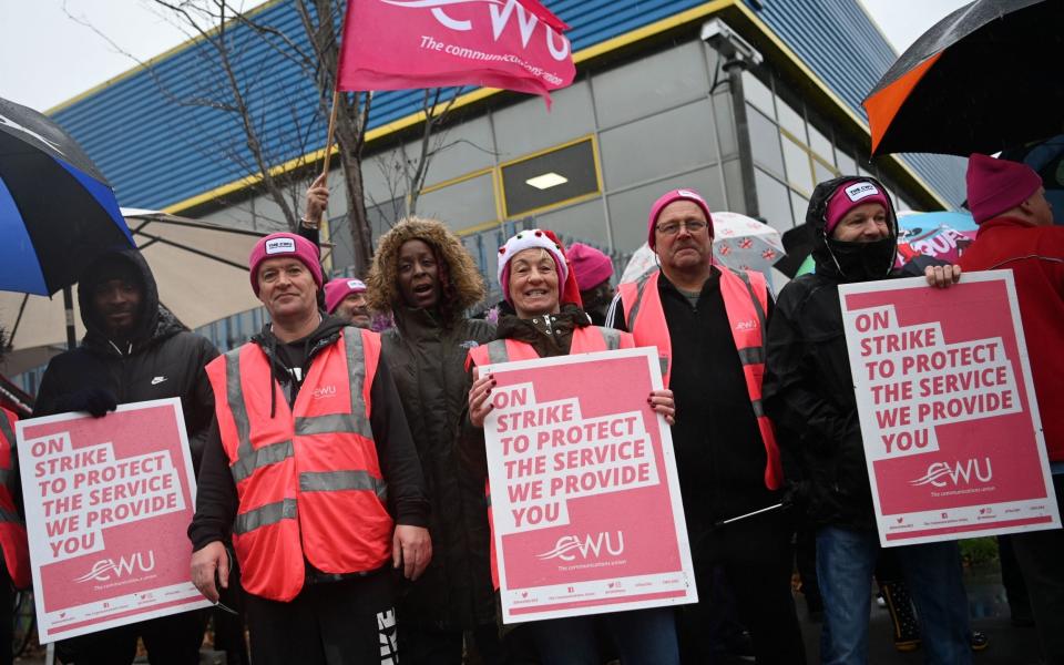 Mandatory Credit: Photo by ANDY RAIN/EPA-EFE/Shutterstock (13682666h)Royal Mail workers picket outside a Royal Mail depot in London, Britain, 23 December 2022. Royal Mail workers across Britain are continuing with a series of strikes over an ongoing dispute for salaries and working conditions.Royal Mail workers strike in London, United Kingdom - 23 Dec 2022 - ANDY RAIN/EPA-EFE/Shutterstock