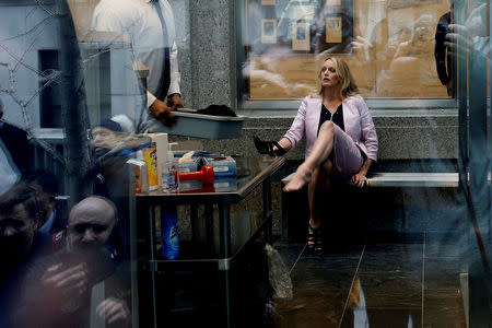 Adult-film actress Stephanie Clifford, also known as Stormy Daniels, puts her shoe back on after passing through a security screening, as she arrives at federal court in the Manhattan borough of New York City, New York, U.S., April 16, 2018. Reuters photographer Shannon Stapleton: "On the morning that I took this picture there was a mad scrum outside the courthouse to get a picture of Stormy Daniels. She didn't enter the regular entrance of a media gauntlet that was set up for her. I placed myself by a window where I saw her passing through the metal detector. Shooting through the window was difficult but I was able to make the frame." REUTERS/Shannon Stapleton