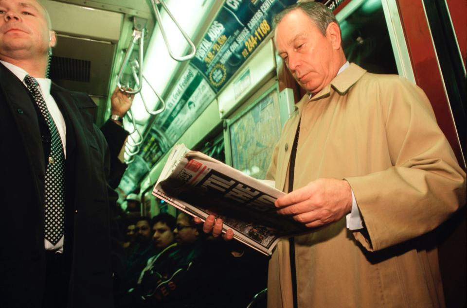 Mike Bloomberg riding mass transportation in the city.