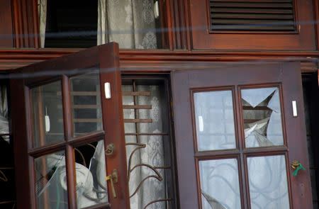 FILE PHOTO: Broken windows are seen at the family home of a bomber suspect where an explosion occurred during a Special Task Force raid, following a string of suicide attacks on churches and luxury hotels, in Colombo, Sri Lanka April 25, 2019. REUTERS/Thomas Peter/File Photo