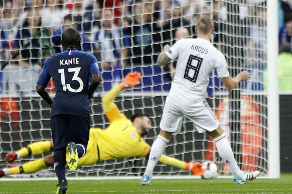 Germany's Toni Kroos, right, scores his side opening goal during their UEFA Nations League soccer match between France and Germany at Stade de France stadium in Saint Denis, north of Paris, Tuesday, Oct. 16, 2018. (AP Photo/Francois Mori)