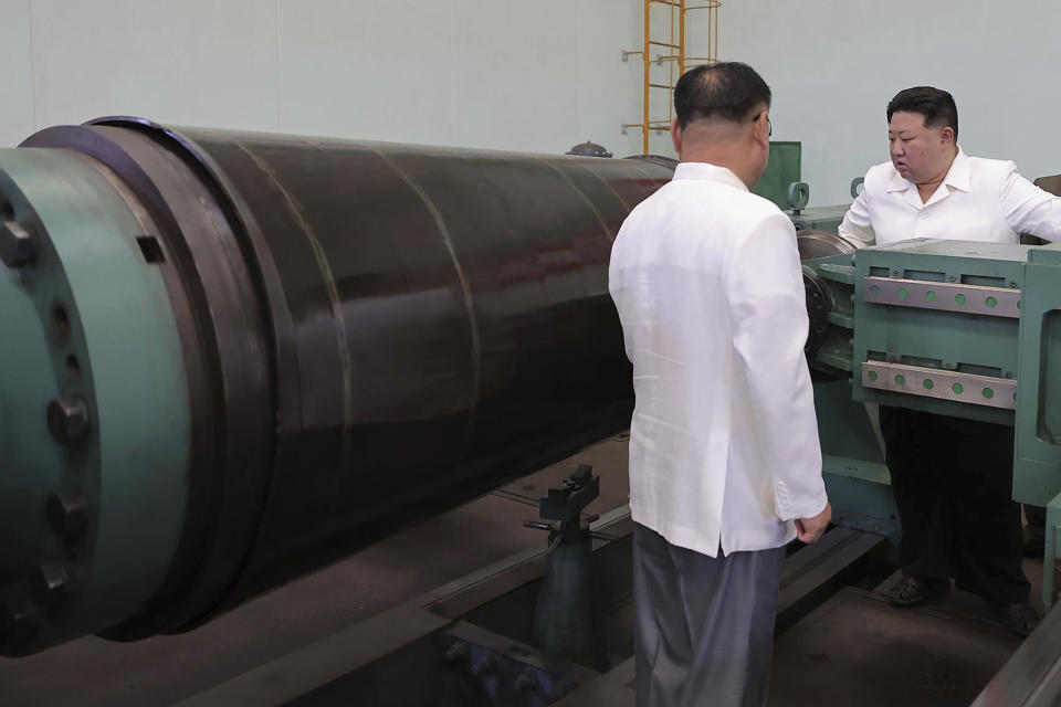 In this undated photo provided on Monday, Aug. 14, 2023, by the North Korean government, North Korean leader Kim Jong Un, right, visits a military factory during his Aug. 11-12 visit, in North Korea. Independent journalists were not given access to cover the event depicted in this image distributed by the North Korean government. The content of this image is as provided and cannot be independently verified. (Korean Central News Agency/Korea News Service via AP)