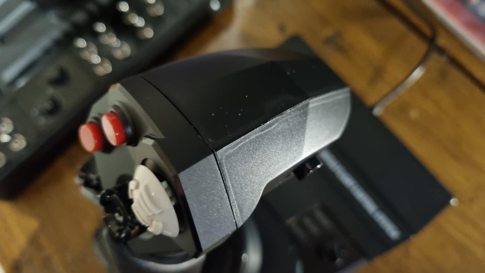 The top of the Hori HOTAS flight stick in close-up, showing a clearly visible seam