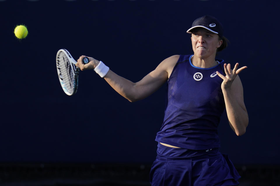 Iga Swiatek, of Poland, returns to Donna Vekic, of Croatia, during the final match at the San Diego Open tennis tournament Sunday, Oct. 16, 2022, in San Diego. (AP Photo/Gregory Bull)