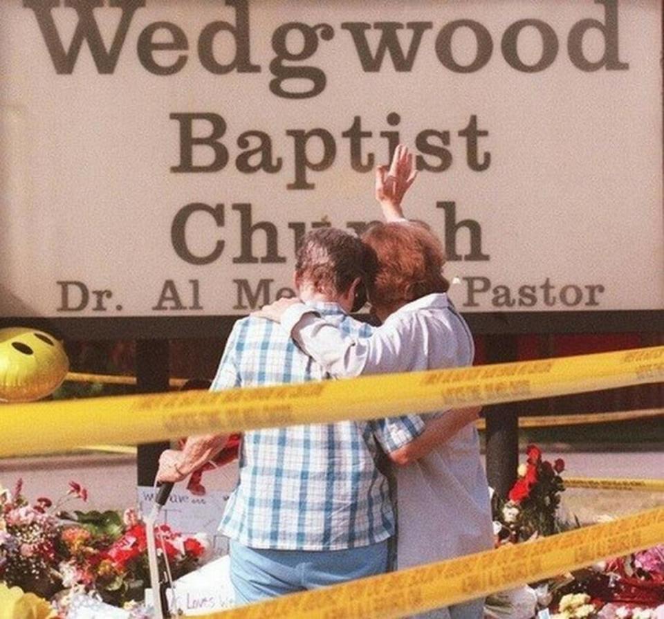 Two women console each other shortly after the fatal shooting at Wedgewood Baptist Church in Fort Worth in 1999. The shooting led to the creation of the Mental Health Connection to improve access to mental health services in Tarrant County. 