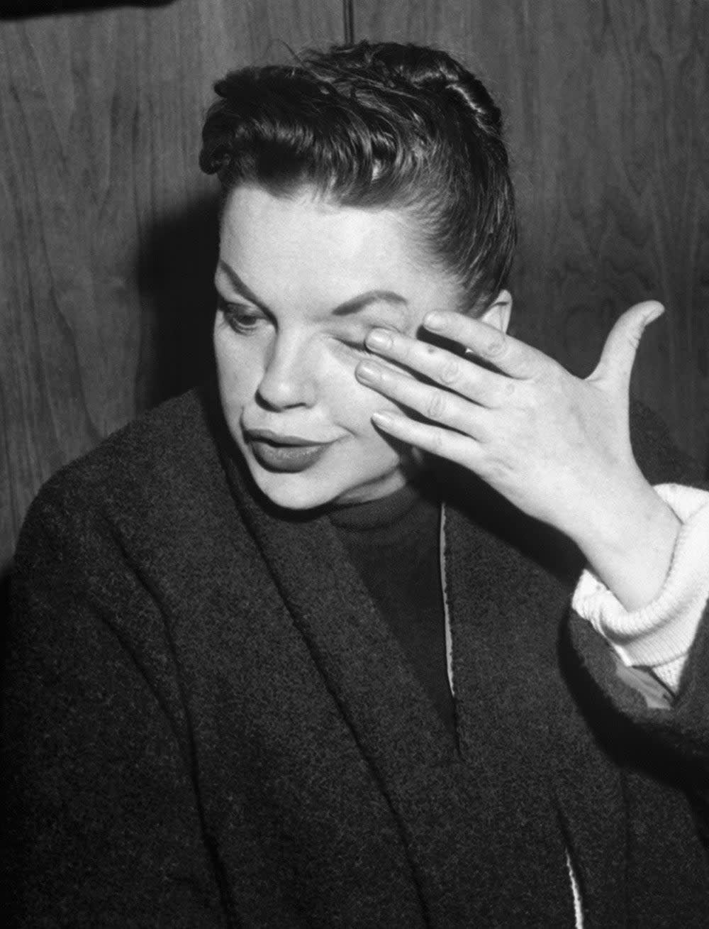Judy Garland wiping her tears.