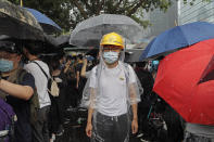 Protestors gather near the Legislative Council in Hong Kong, Wednesday, June 12, 2019. Thousands of protesters blocked entry to Hong Kong's government headquarters Wednesday, delaying a legislative session on a proposed extradition bill that has heightened fears over greater Chinese control and erosion of civil liberties in the semiautonomous territory. (AP Photo/Kin Cheung)