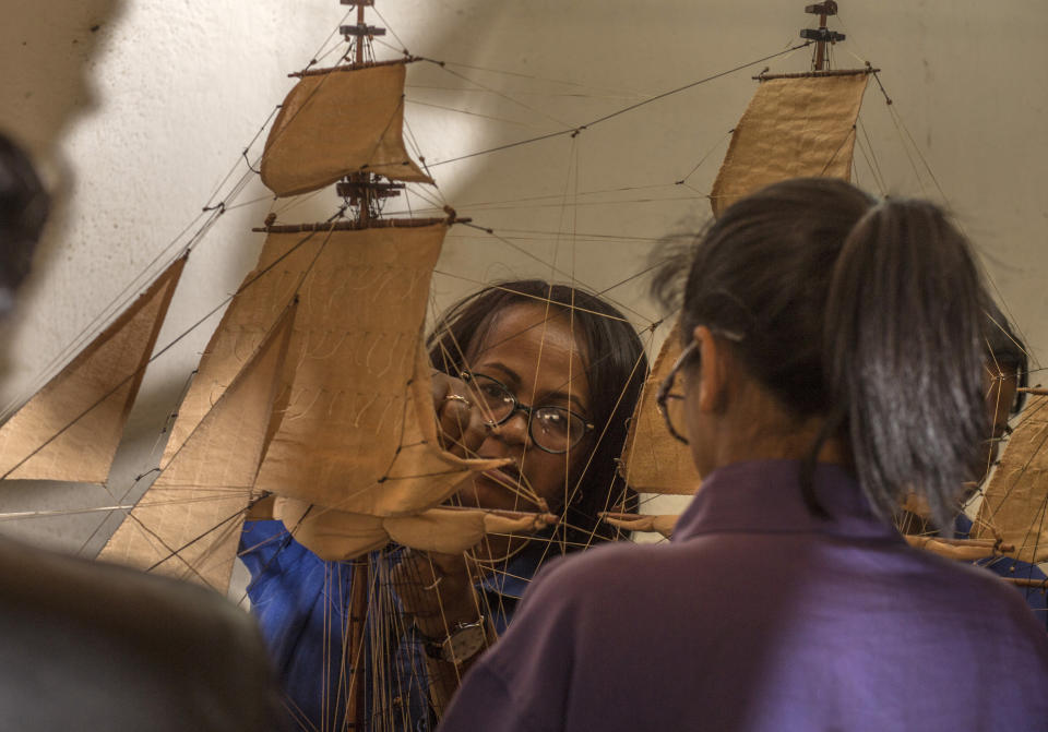 Malagasy women build a model ship at the Le Village model ship making company in Antananarivo, Madagascar, Wednesday, Sept. 11, 2024. (AP Photo/Alexander Joe)