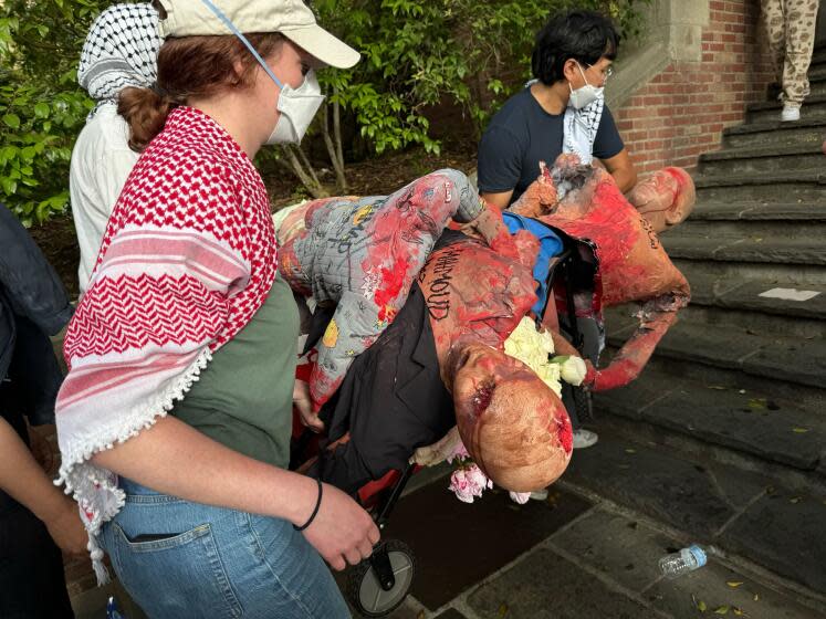 Demonstrators carry fake corpses during a pro-Palestinian protest Monday on the UCLA campus. Alene Tchekmedyian / Los Angeles Times