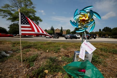 Messages adorn a token placed at a makeshift memorial outside a municipal government building where a shooting incident occurred in Virginia Beach, Virginia