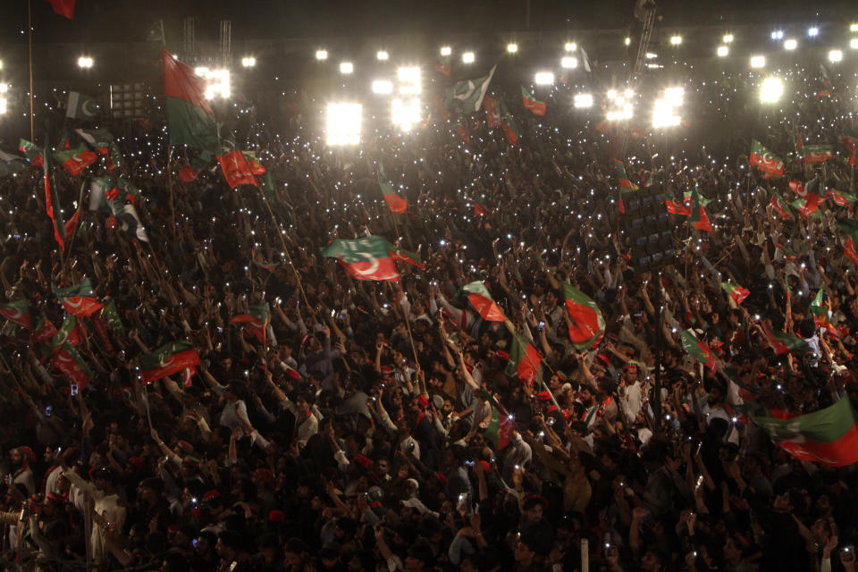 Supporters of Pakistani opposition leader Imran Khan's Tehreek-e-Insaf party attend a rally, in Peshawar, Pakistan, Tuesday, Sept. 6, 2022. Since he was toppled by parliament five months ago, former Prime Minister Imran Khan has demonstrated his popularity with rallies that have drawn huge crowds and signaled to his rivals that he remains a considerable political force. (AP Photo/Mohammad Sajjad)