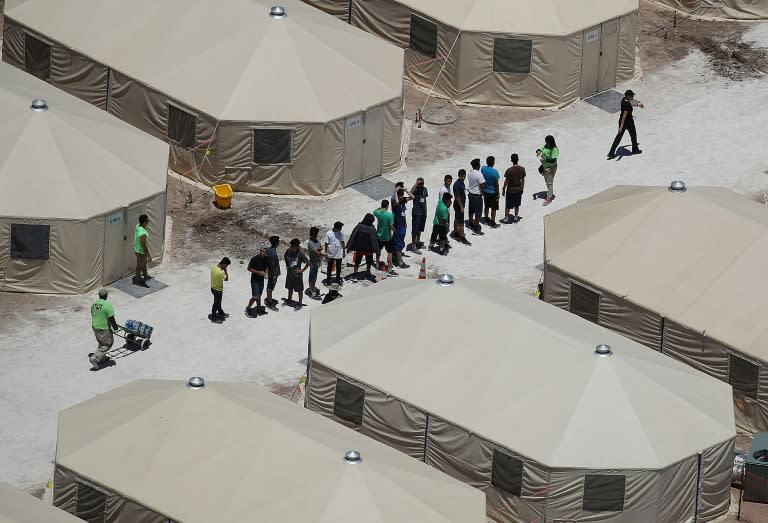 Children and workers are seen June 19, 2018 at a tent encampment recently built for migrant children near the border in Tornillo, Texas