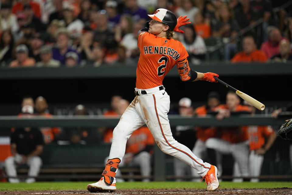 Baltimore Orioles' Gunnar Henderson follows through while hitting a two-run home run to score Adam Frazier in the second inning of a baseball game against the Tampa Bay Rays, Saturday, Sept. 16, 2023, in Baltimore. (AP Photo/Julio Cortez)