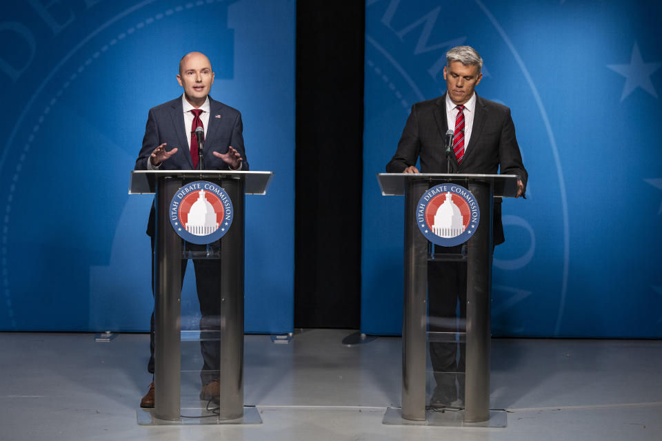 Incumbent Gov. Spencer Cox, left, speaks as Utah Rep. Phil Lyman listens during Utah's gubernatorial GOP primary debate, at the Eccles Broadcast Center, Tuesday, June 11, 2024, in Salt Lake City. (Isaac Hale/The Deseret News via AP)