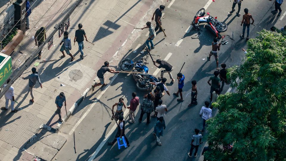 Protesters vandalize motorcycles in Dhaka on July 18, 2024. - Stringer/AFP/Getty Images