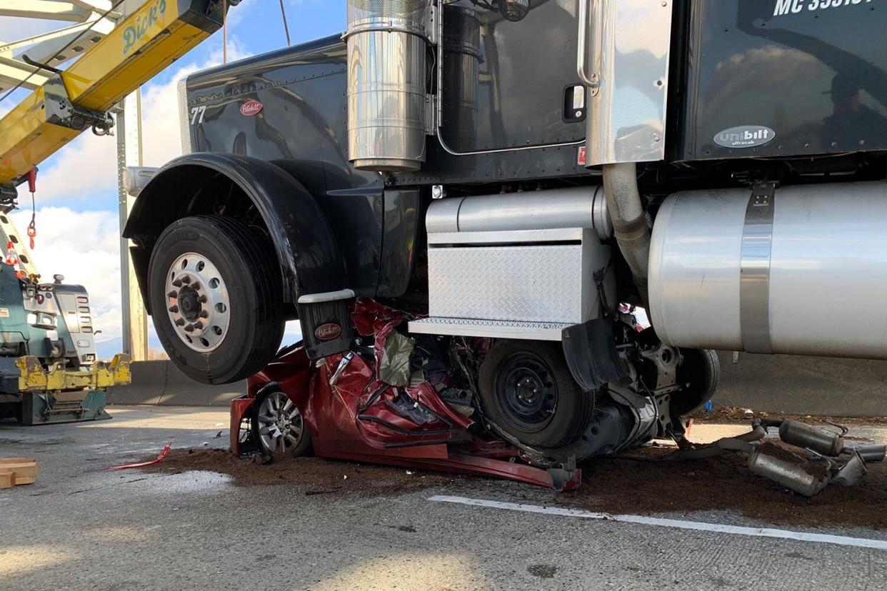 Woman Miraculously Escapes After Semi Truck Crushes Her Nissan Altima