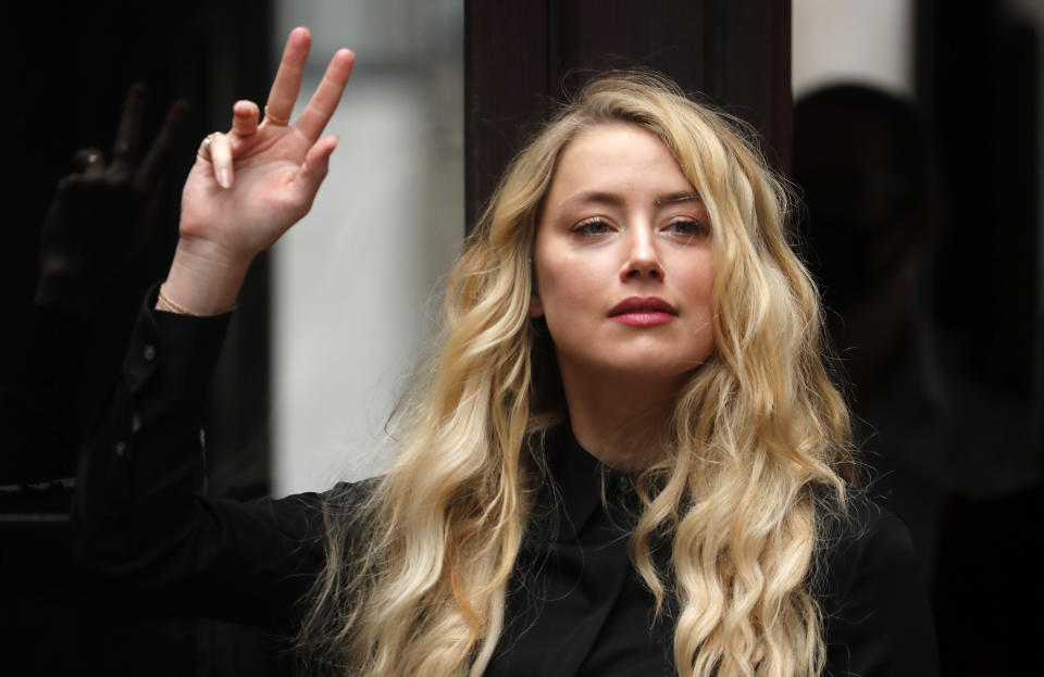 US Actress Amber Heard, former wife of actor Johnny Depp, arrives at the High Court in London, Tuesday, July 28, 2020. Hollywood actor Johnny Depp is suing News Group Newspapers over a story about his former wife Amber Heard, published in The Sun in 2018 which branded him a 'wife beater', a claim he denies. (AP Photo/Frank Augstein)