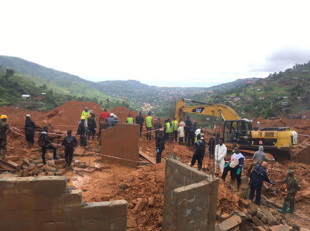 Rescue workers are pictured after a mudslide in the mountain town of Regent, Sierra Leone August 14, 2017, in this image obtained from social media. UN/Linnea Van Wagenen/Social Media via REUTERS