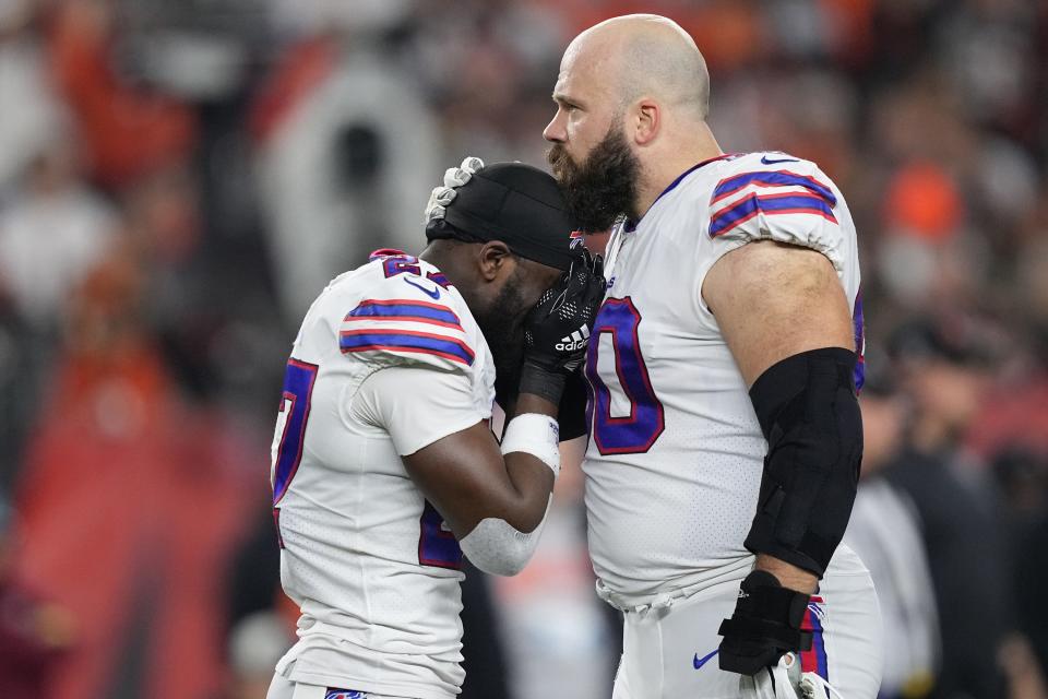 Tre'Davious White (27) and Mitch Morse (60) of the Buffalo Bills react to teammate Damar Hamlin (3) collapsing after making a tackle against the Cincinnati Bengals during the first quarter at Paycor Stadium on Monday, Jan. 2, 2023, in Cincinnati. (Dylan Buell/Getty Images/TNS) ORG XMIT: 68029357W