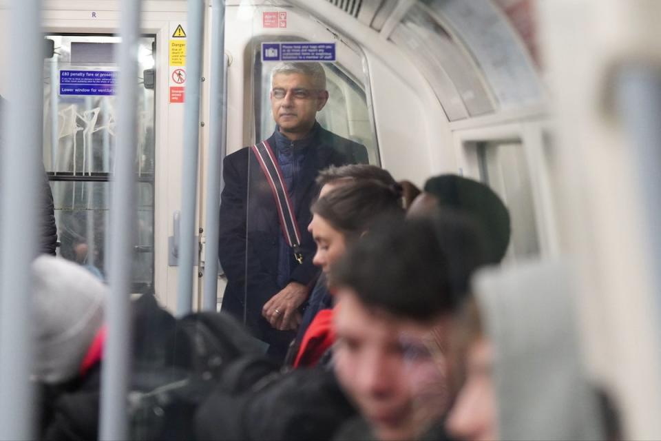 Sadiq Khan joined morning commuters on a Jubilee line train on Friday (PA)