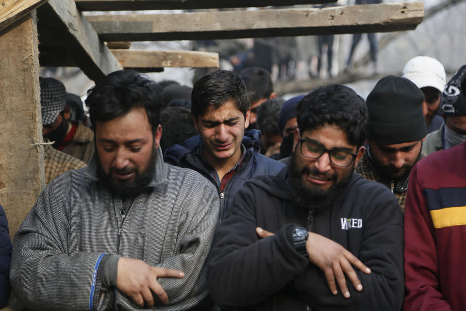 Kashmiri men wail during the funeral of killed rebel Khalid Farooq, in Shopian village, south of Srinagar, Indian controlled Kashmir, Sunday, Nov. 25, 2018. Six rebels and an army soldier were killed in a gunbattle in Indian-controlled Kashmir on Sunday, officials said, sparking violent protests by residents seeking an end to Indian rule over the disputed region and leaving a teenage boy dead and 20 people injured. (AP Photo/Mukhtar Khan)