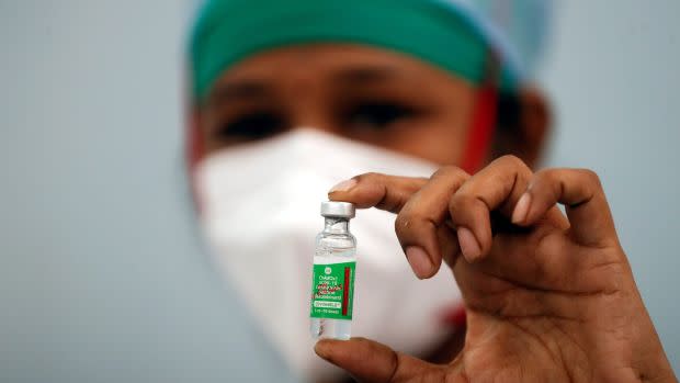 FILE PHOTO: A nurse displays a vial of COVISHIELD, the AstraZeneca COVID-19 vaccine manufactured by Serum Institute of India, in Mumbai