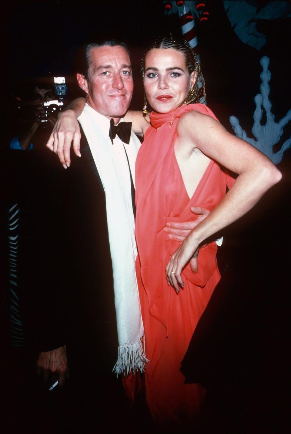 <p>Halston socialized with some of Hollywood's biggest stars. He's pictured here with actress and model Margaux Hemingway.</p>