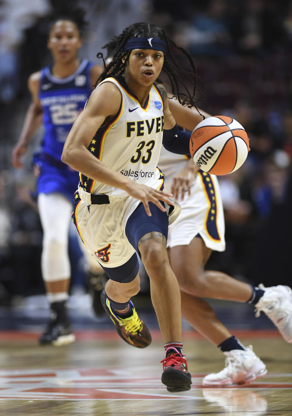 Indiana Fever guard Destanni Henderson (33) leads the fast break against the Connecticut Sun during a WNBA basketball game Friday, May 20, 2022, in Uncasville, Conn. (Sean D. Elliot/The Day via AP)