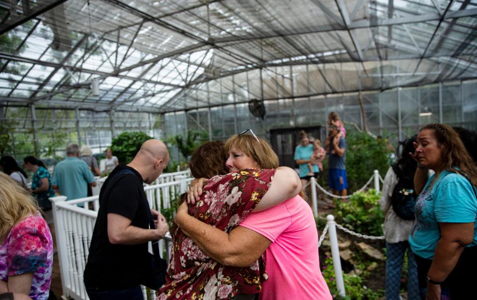 Elizabeth Wilkerson gets a hug during the last butterfly release at the Florida Native Butterfly Society’s butterfly house in Fort Myers on Friday, July 28, 2023. The Florida Native Butterfly Society’s butterfly house at the Butterfly Estates closed on Friday. Wilkerson is the butterfly breeder at the estates.