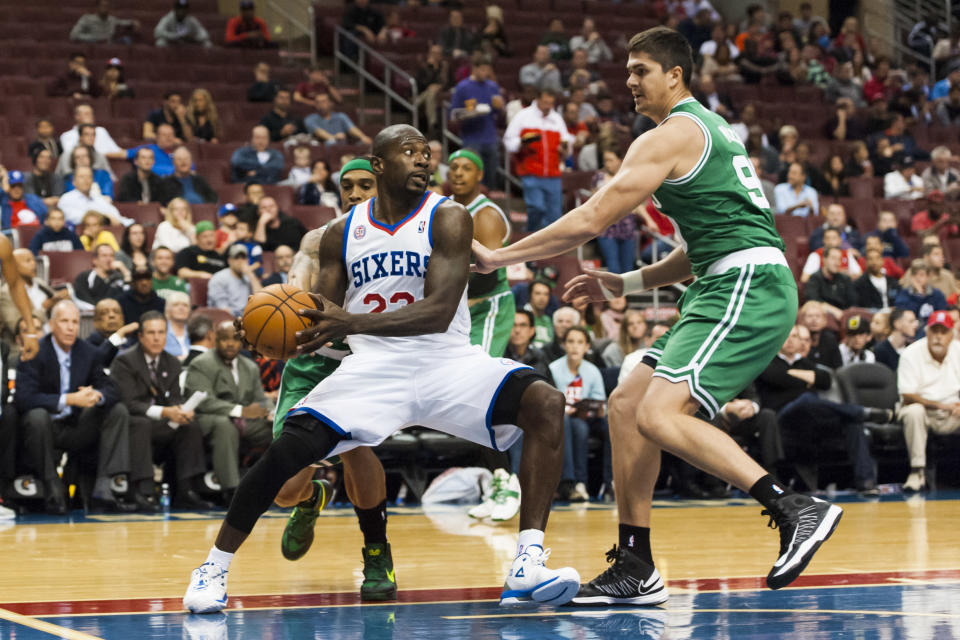 Oct 15, 2012; Philadelphia, PA, USA; Philadelphia 76ers guard Jason Richardson (23) is defended by Boston Celtics center Darko Milicic (99) during the first quarter at the Wachovia Center. Mandatory Credit: Howard Smith-USA TODAY Sports