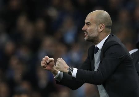 Britain Football Soccer - Manchester City v AS Monaco - UEFA Champions League Round of 16 First Leg - Etihad Stadium, Manchester, England - 21/2/17 Manchester City manager Pep Guardiola celebrates Reuters / Phil Noble Livepic