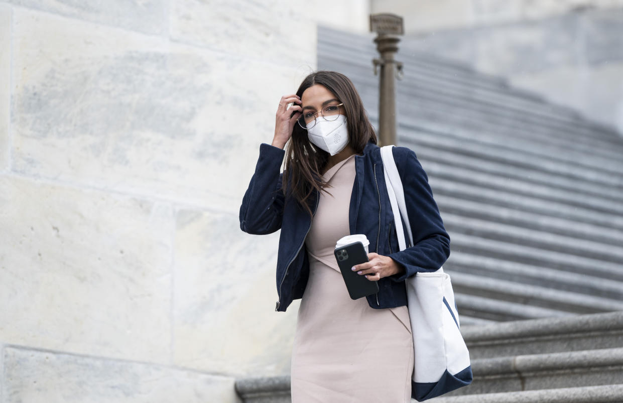 Rep. Alexandria Ocasio-Cortez, D-N.Y., wears a face mask as she walks down the House steps of the U.S. Capitol before a House vote on April 23.(Photo By Bill Clark/CQ-Roll Call, Inc via Getty Images)