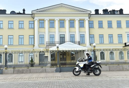 A policeman rides past the presidential palace in the Finnish capital Helsinki, a city which was a hotbed of spies during the Cold War