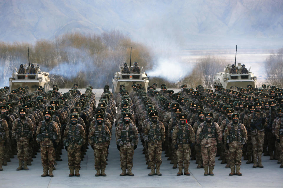 Chinese soldiers rally while training in -20 degrees Celsius (-4 Fahrenheit) conditions in Kashgar in northwestern China's Xinjiang Uighur Autonomous Region on Monday, Jan. 4, 2021. An official from China's Communist Party signaled last December that there would likely be no letup in its crackdown in the remote Xinjiang region, but said the government's focus is shifting more to addressing the roots of extremism. (Chinatopix Via AP)