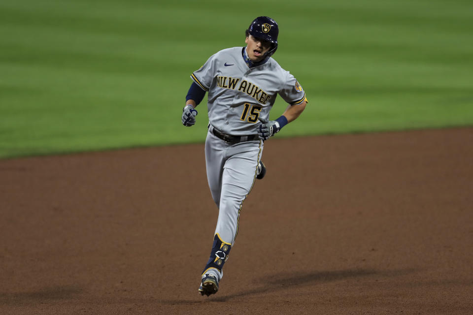 Milwaukee Brewers' Tyrone Taylor runs the bases after hitting a solo home run in the fifth inning of a baseball game against the Cincinnati Reds in Cincinnati, Tuesday, Sept. 22, 2020. (AP Photo/Aaron Doster)
