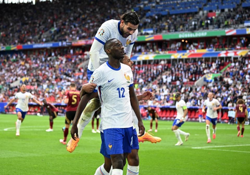 France's Randal Kolo Muani celebrates scoring their first goal with teammates. —Reuters pic