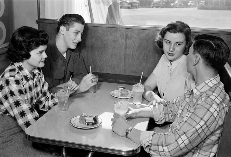 Circa 1950s: Double scoop, double date
