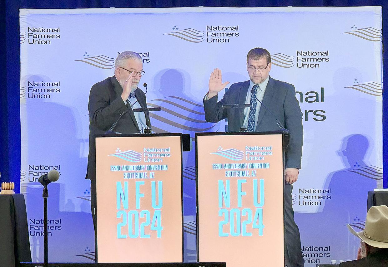 Aberdeen farmer Jeff Kippley, right, is sworn in to serve a second term as the National Farmers Union vice president on Monday, March 11, 2024 during the organization’s national convention in Scottsdale, Ariz..