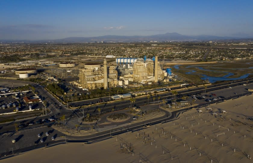 HUNTINGTON BEACH, CA - February 17: A view of the older AES Huntington Beach Power Station at left, and new one at right, and is the proposed site of the Poseidon Desalination Plant, which would draw ocean water through an existing intake pipe at Wednesday, Feb. 17, 2021 in Huntington Beach, CA. (Allen J. Schaben / Los Angeles Times)